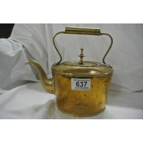 637 - An antique brass kettle.