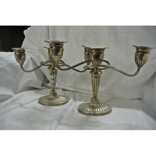 643 - A pair of silver plated candelabras.