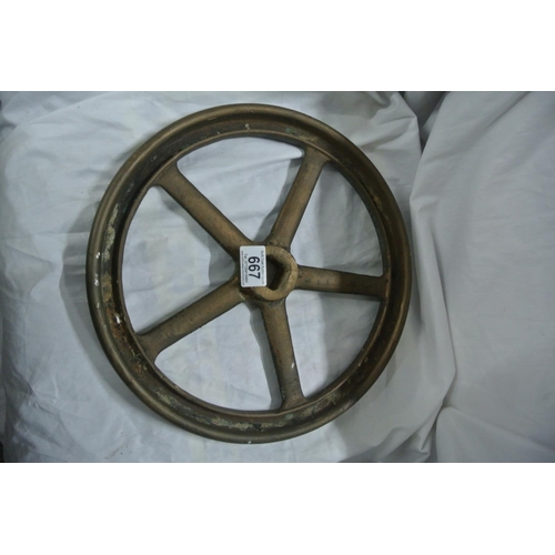 667 - An antique bronze cast wheel.