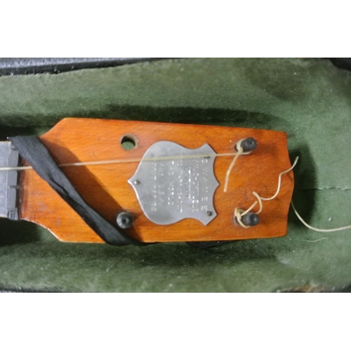 668 - A vintage cased SWANEE banjo Ukulele.