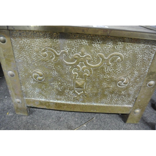 669 - An antique/ vintage decorative embossed brass fireside box, with liner.