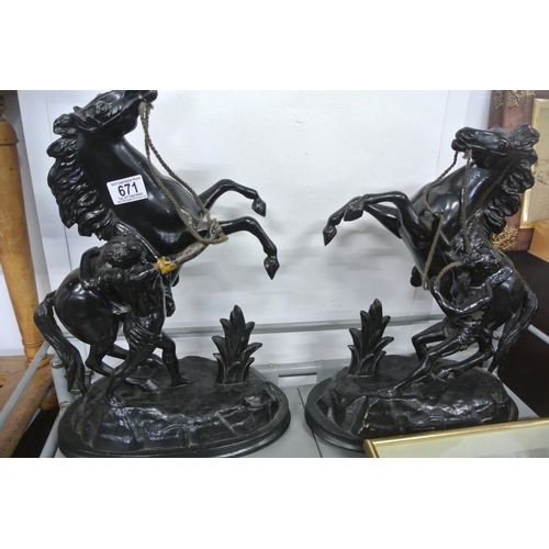 671 - A pair of metal rearing horse figures. (1 a/f)