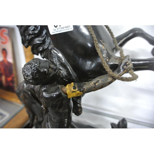 671 - A pair of metal rearing horse figures. (1 a/f)