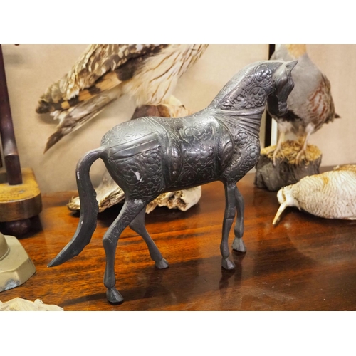 128 - A stunning hollow cast bronze horse with decorative design.