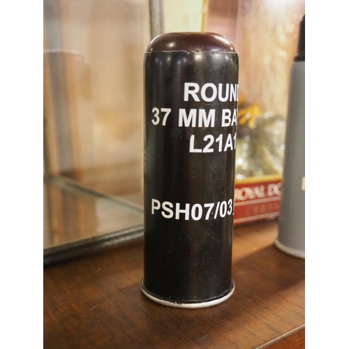 139 - A 37mm Baton round/ rubber bullet.