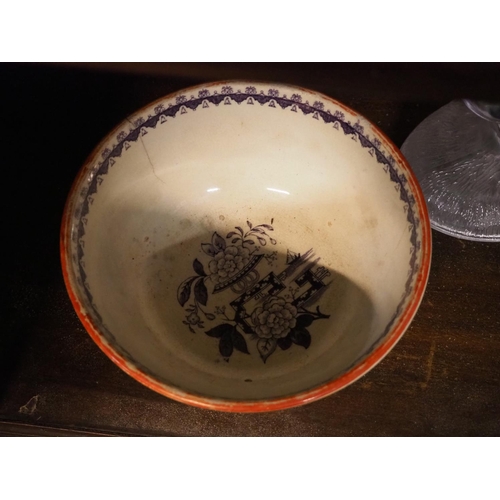 148 - A decorative antique bowl with hand coloured design.