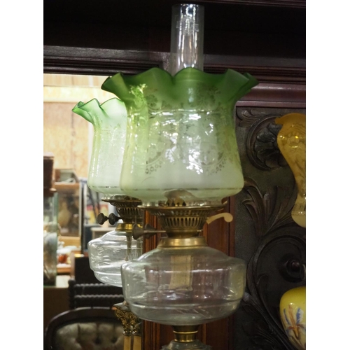 393 - A stunning antique oil lamp with brass & marble effect base, decorative clear font & etched green gl... 