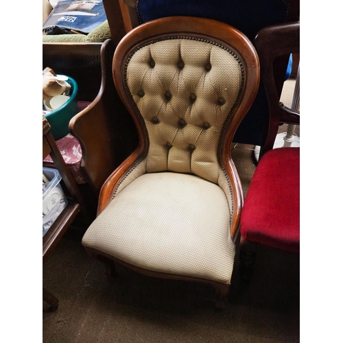 482 - An antique spoonback chair with button back upholstery.