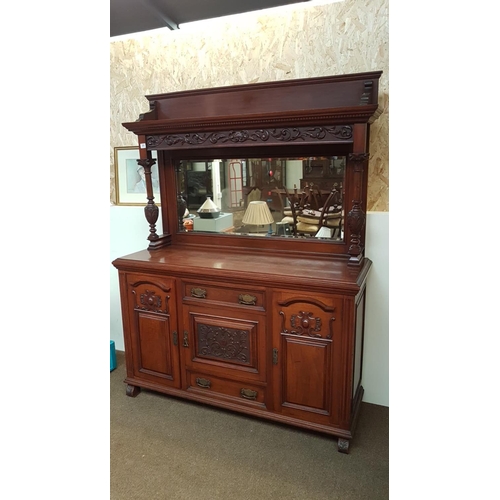 359 - A stunning antique sideboard with decorative carved panels & bevelled mirror back.