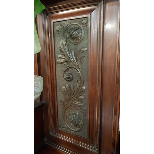 378 - A stunning antique mirror back sideboard with decoratively carved panels.