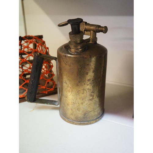 11 - An antique brass pressure sprayer.