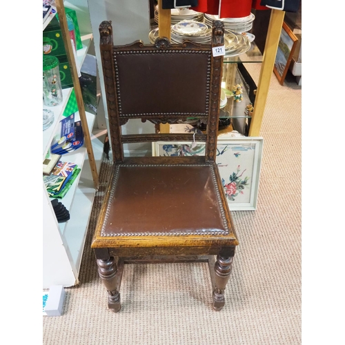 121 - An antique hall chair.