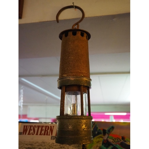 130 - An antique Miners lamp.