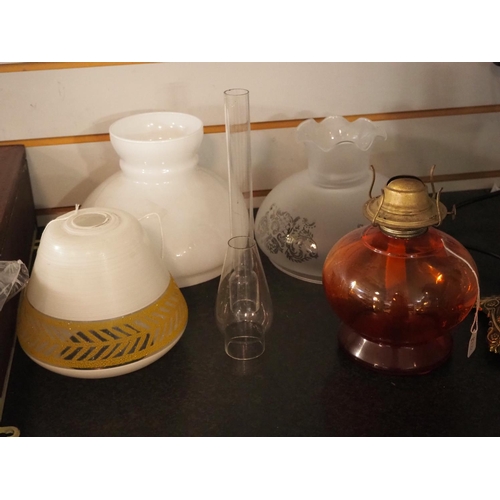 163 - An assortment of various glass shades & an oil lamp base.