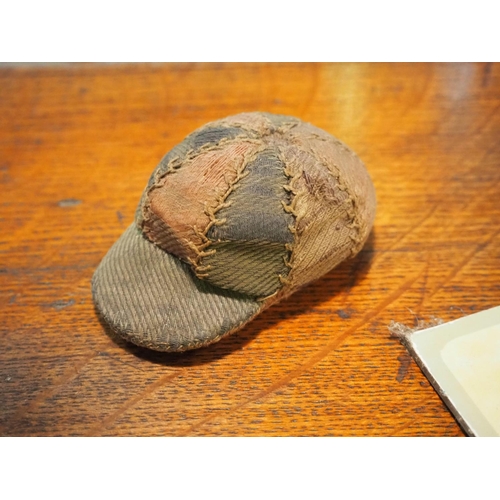173 - An antique pin cushion styled as a Jockeys cap.
