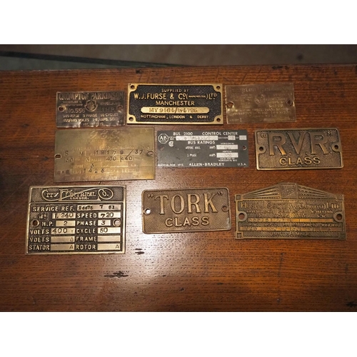 184 - A collection of 9 brass plaques.