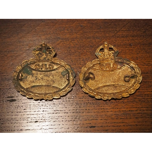 190 - A pair of antique brass & enamel GPO badges.