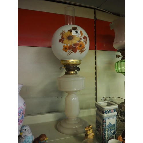 38 - An antique oil lamp with white glass font & decorative shade.