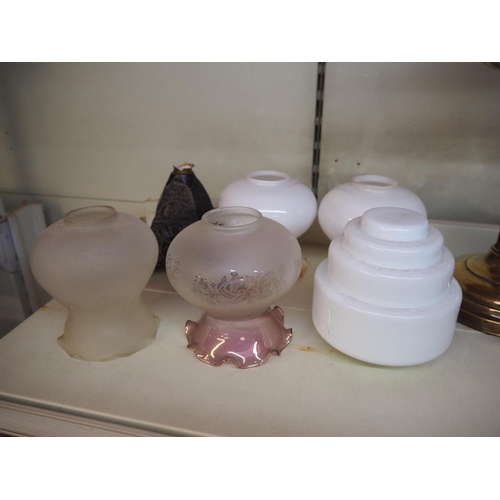 8 - A collection of 5 glass shades & an oil lamp base.