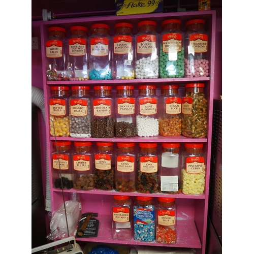 88 - A large assortment of shop sweet jars, with contents.
