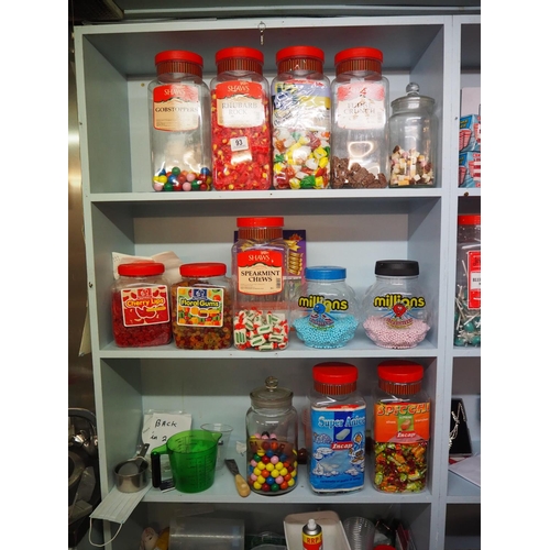 93 - A large assortment of shop sweet jars, with contents.