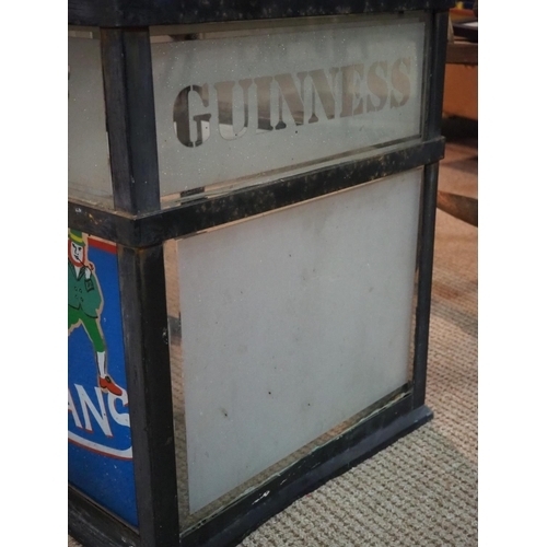 254 - A large vintage pub lantern on bracket, with glass panels reading Guinness, Smithwicks, McSwiggans &... 