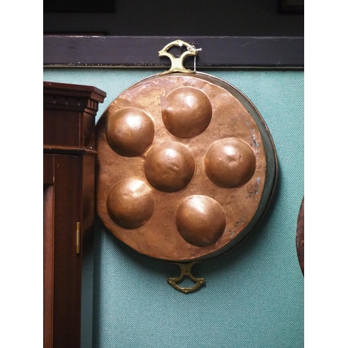 324 - An antique copper dumpling pan.