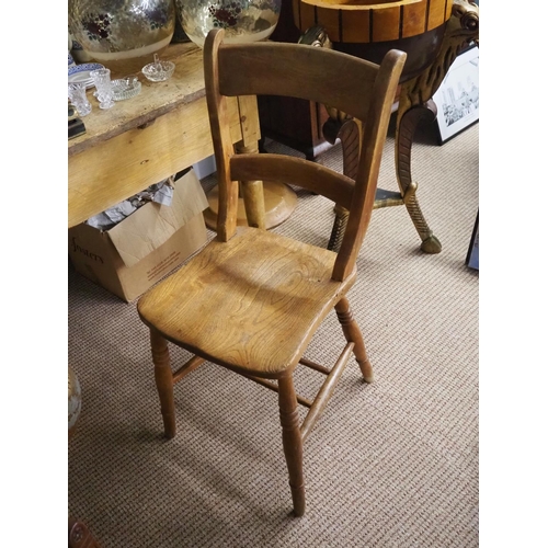 371 - An antique wooden dining chair.