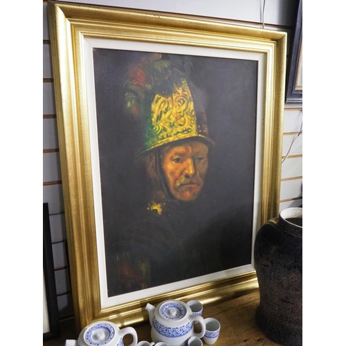 378 - A large framed portrait of a man wearing a helmet.