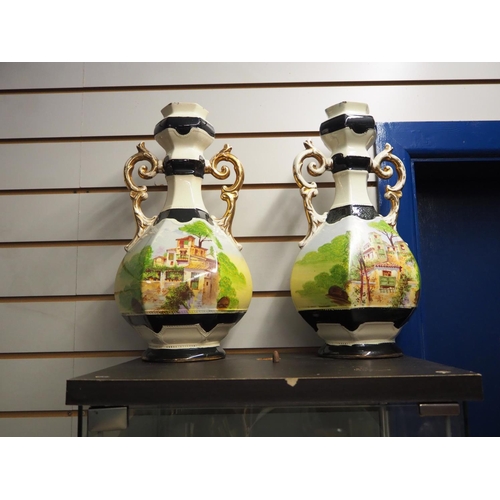 389 - A pair of antique hand painted vases.