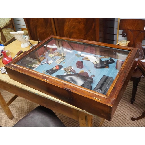 411 - A glass counter top display cabinet.