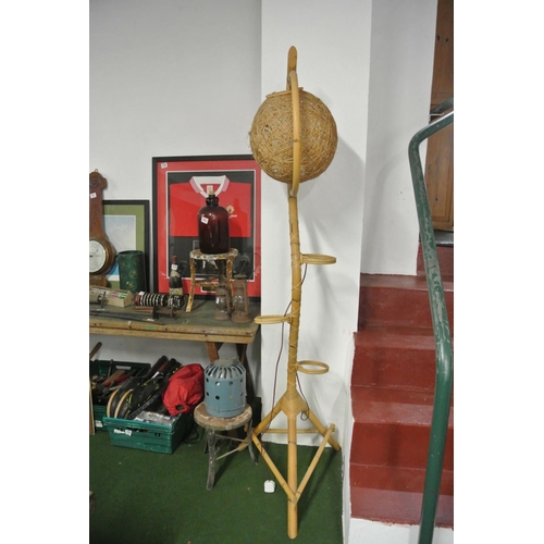 732 - A vintage/ retro wicker/ bamboo standard lamp with wicker ball shade & space for 3 plant pots.