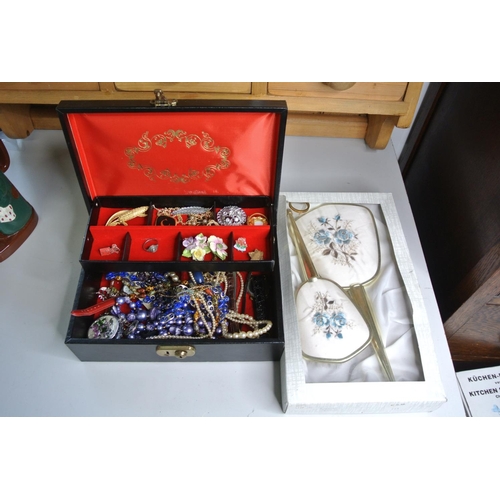 314 - A leather jewellery box to include costume jewellery and watches etc