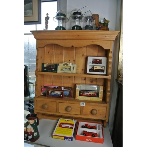 318 - An Irish Pine wall mounted plate rack with three drawers
