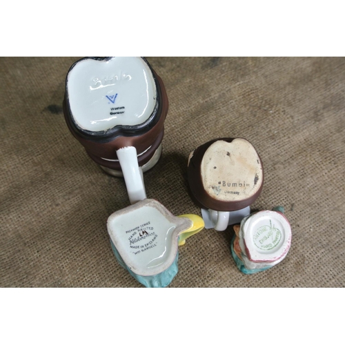 420 - A collection of four toby jugs