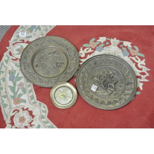 733 - A lot of two circular brass plaques and another