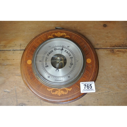 765 - AN oak cased Barometer