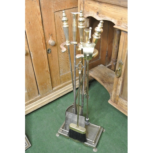 778 - A brass fire companion set (with spare poker & shovel)