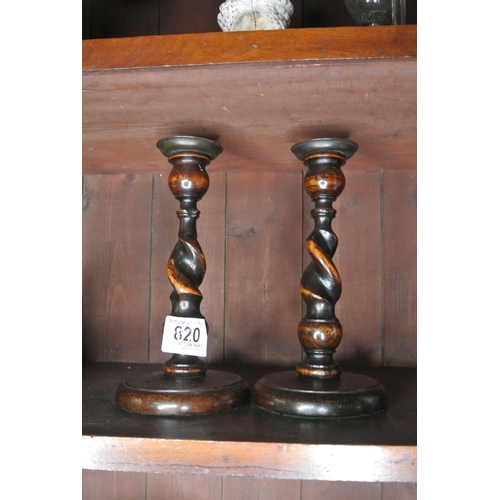 820 - A pair of oak barley twist candlesticks