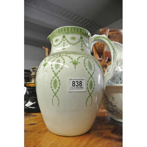 838 - A large green and white water jug