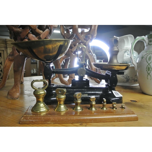 839 - An old style set of kitchen scales , 2lb weight and set of weights on stand.