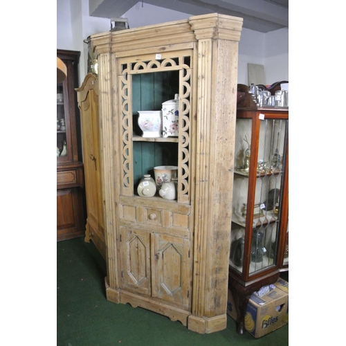 853 - A large pine corner cupboard