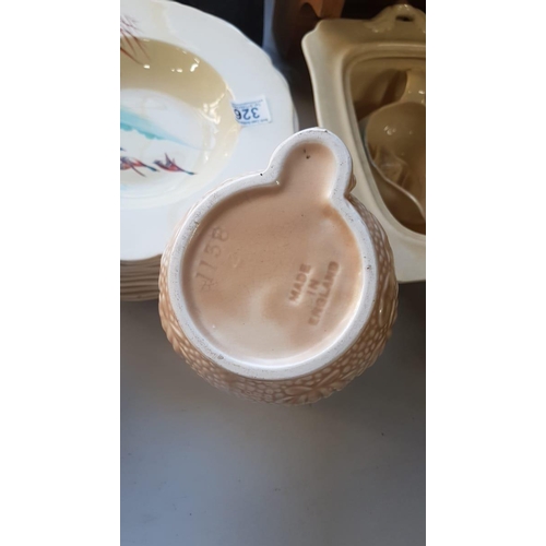 327 - A tan Sylvac Heron handle water Jug