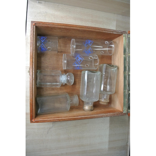 92 - A small lidded display case with various bottles included.