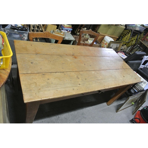 318 - A pine rectangular kitchen table drawer to one side