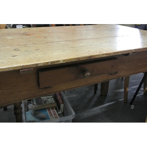 318 - A pine rectangular kitchen table drawer to one side