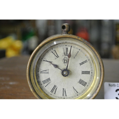 363 - A small antique clock made by Davie Ltd England