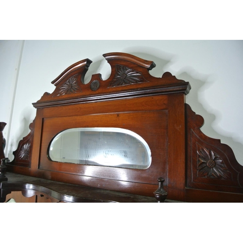 435 - A stunning antique mahogany mirror backed display cabinet, curved glass doors and carved detail