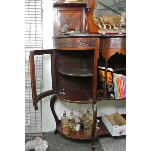 435 - A stunning antique mahogany mirror backed display cabinet, curved glass doors and carved detail