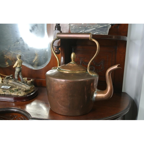 437 - An antique copper and brass kettle